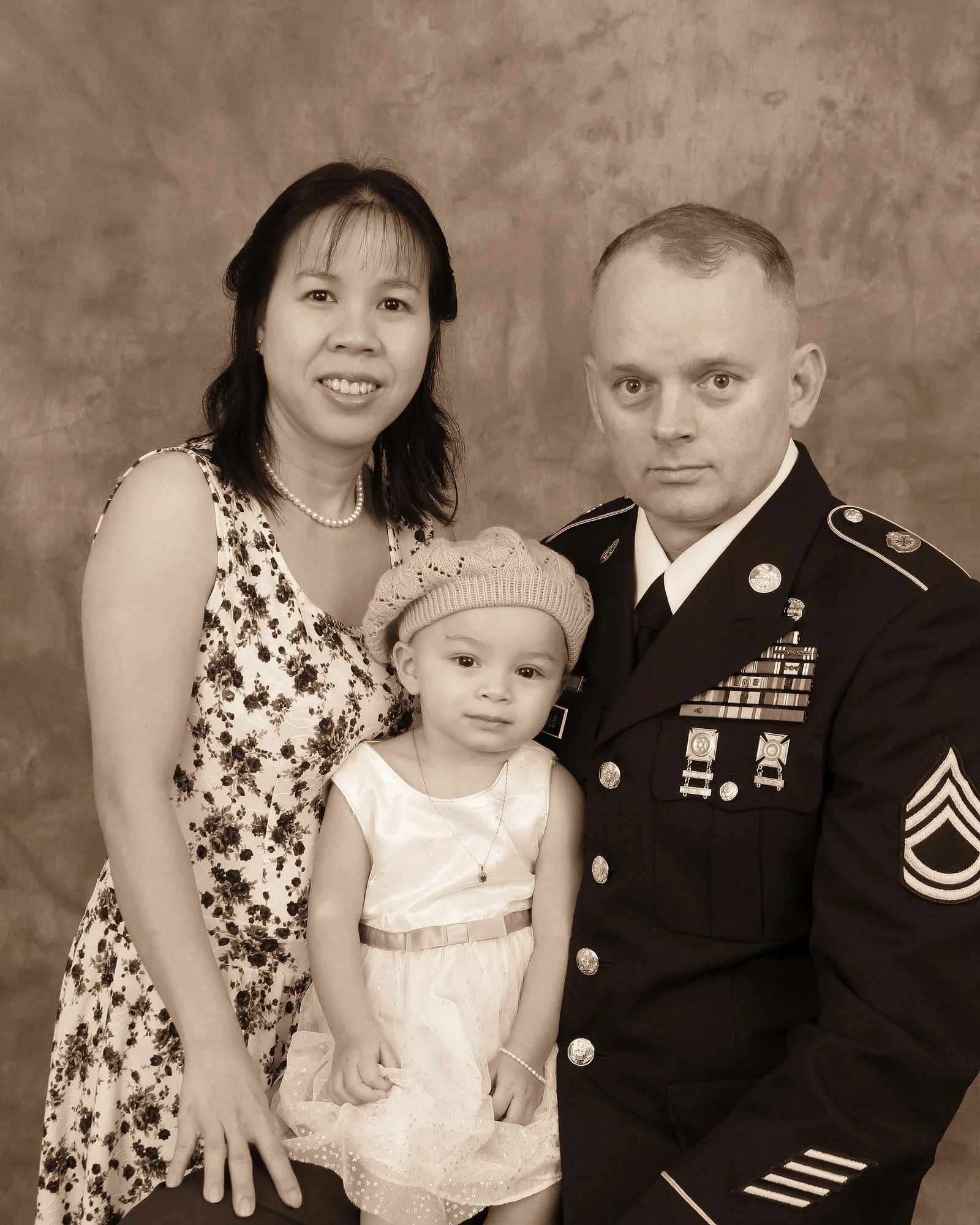Luckie J. McDonald in dress uniform with his wife and daughter